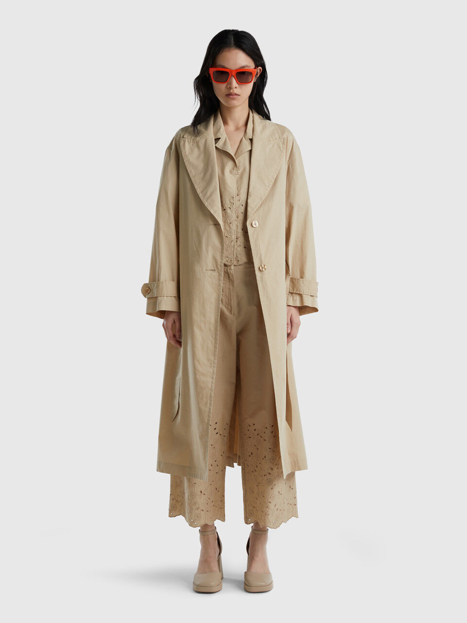 Trench coat with broderie anglaise details