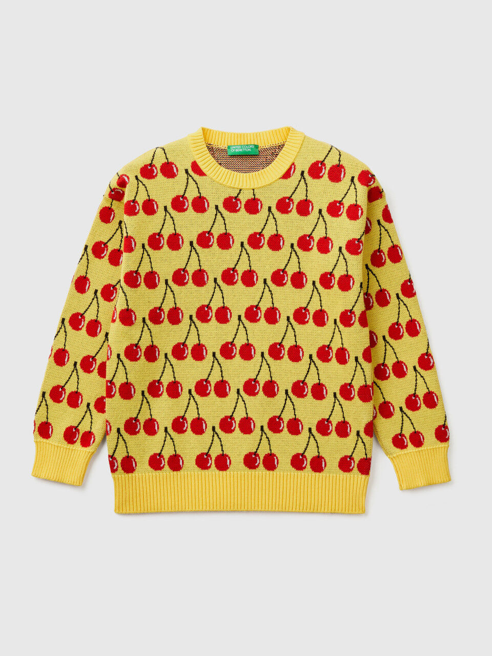 Yellow sweater with cherry pattern