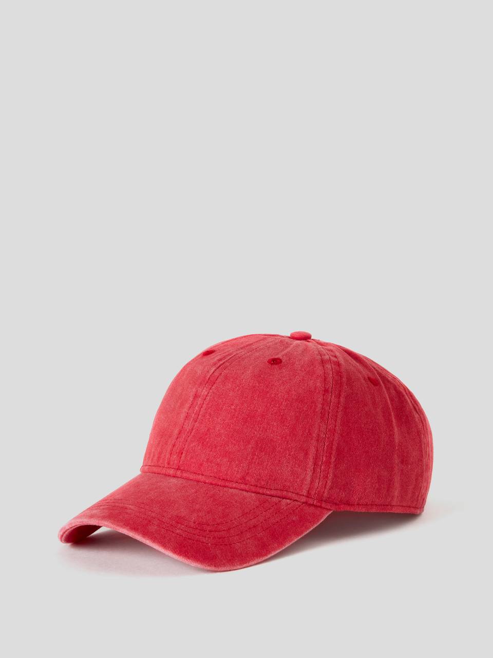 washed red baseball cap